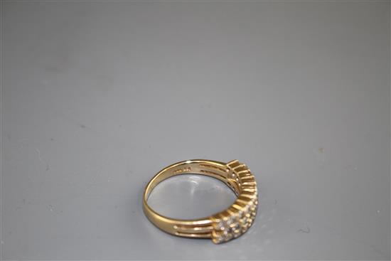 A modern 14k yellow metal and three row diamond set half hoop ring, size O, gross weight 4.3 grams.